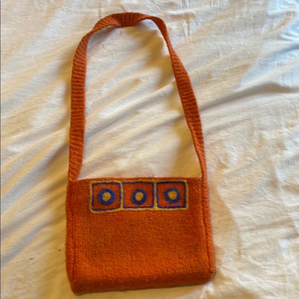 Vibrant Orange and Blue Shoulder Bag with Decorative Elements